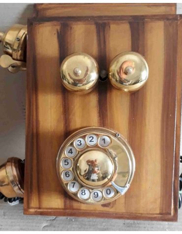 Vintage wall mounted wood & brass telephone : This phone is functional.