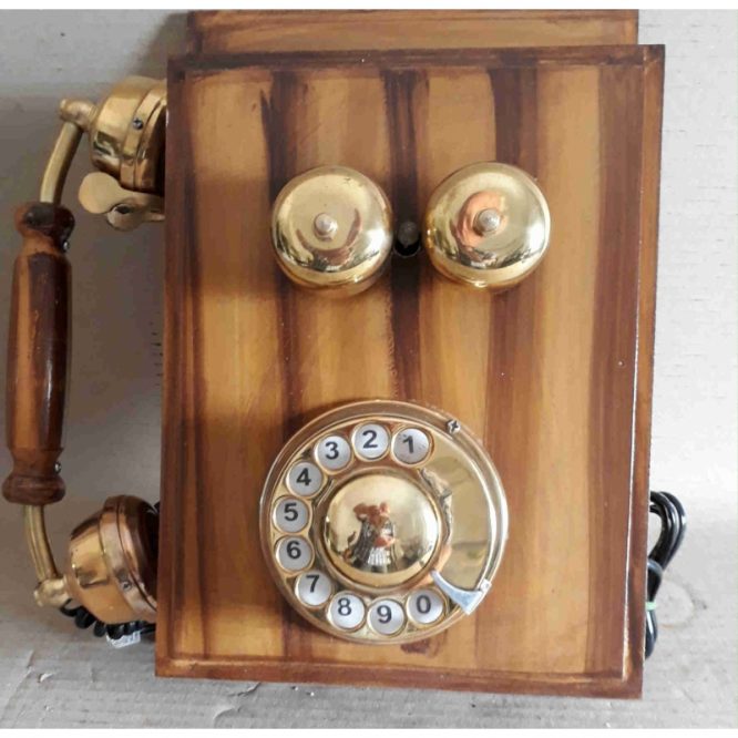 Vintage wall mounted wood & brass telephone : This phone is functional.